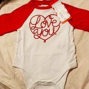 Brand new baby onesie in size newborn.